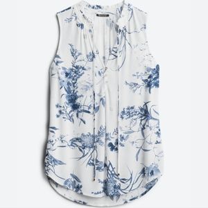 Pink Clover Mahalo Tie Neck top. Size Medium. White with Blue flowers.